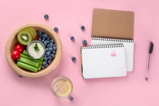 Journal and healthy snack representing mindful eating practice